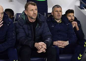 Lions boss Gary Rowett with assistant Adam Barrett, left, and coach Paul Robinson, right. Photo: Millwall FC