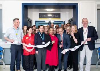 The ribbon cutting moment for the new Lewisham Surgical Centre. Front row l-r: Ben Travis (LGT Chief Executive), Louise Crosby (LGT Chief Nurse), Jennifer Daothong (Chief Executive, Lewisham Council), Mayor Brenda Dacres OBE, Javier Moraleda (LGT ENT Clinical Director), Miranda Jenkins (LGT Chief Operating Officer), Mike Bell (LGT Trust Chair)