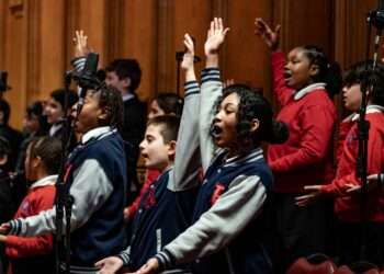 Schoolchildren perform a song