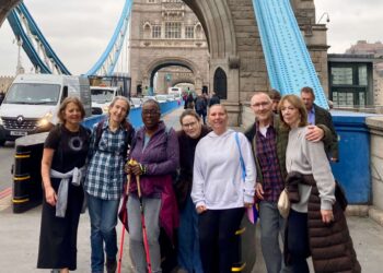 Michael and supporters / staff from the Copleston Centre finishing the 10 mile walk at Tower Bridge. Credit: Michael Holland