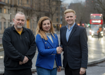 Lina Usma (centre) with Cllr Graham Neale (left) and being welcomed by Cllr Victor Chamberlain (right)