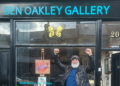 Man celebrates in front to art gallery