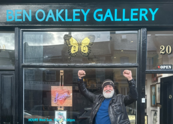 Man celebrates in front to art gallery